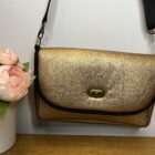 Shoulder Bag, Violet Design, Dark Gold Faux Leather with black piping to the flap, black webbing adjustable shoulder strap